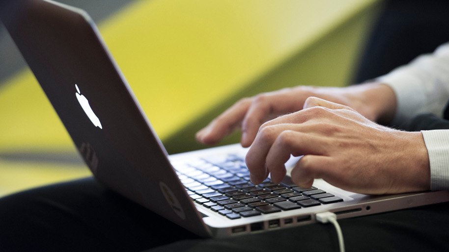 Person typing on laptop