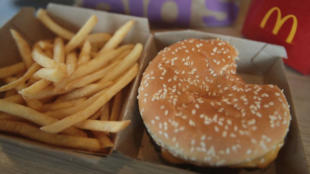 A Quarter Pounder hamburger, which was linked to a recent E.coli outbreak, is served at a McDonald's restaurant on March 30, 2017 in Effingham, Illinois.