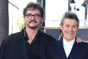 pedro pascal touching wife willem dafoe