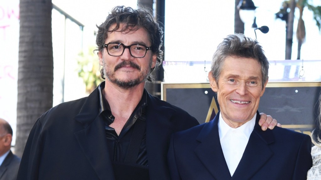pedro pascal touching wife willem dafoe
