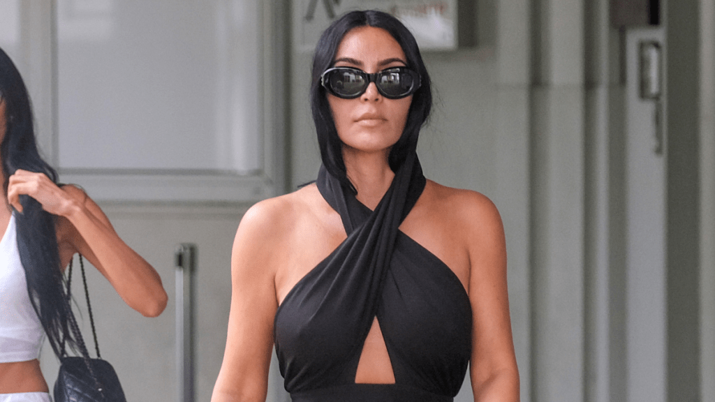 Kim Kardashian Goes Braless & Flaunts Her Curves in Gray Gown