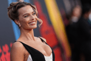 Margot Robbie’s Black Mini Dress Has Fans Saying She’s 'Serving Legs'