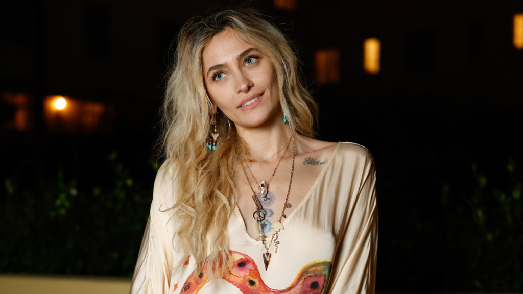Paris Jackson Turns Heads in Bold V-Neck Snake Print Dress