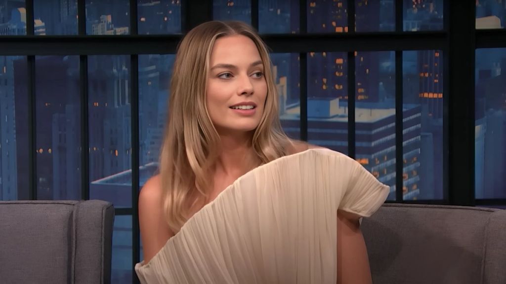 Margot Robbie Explains Why Her Dress's Neckline Is Apt for Shoplifting