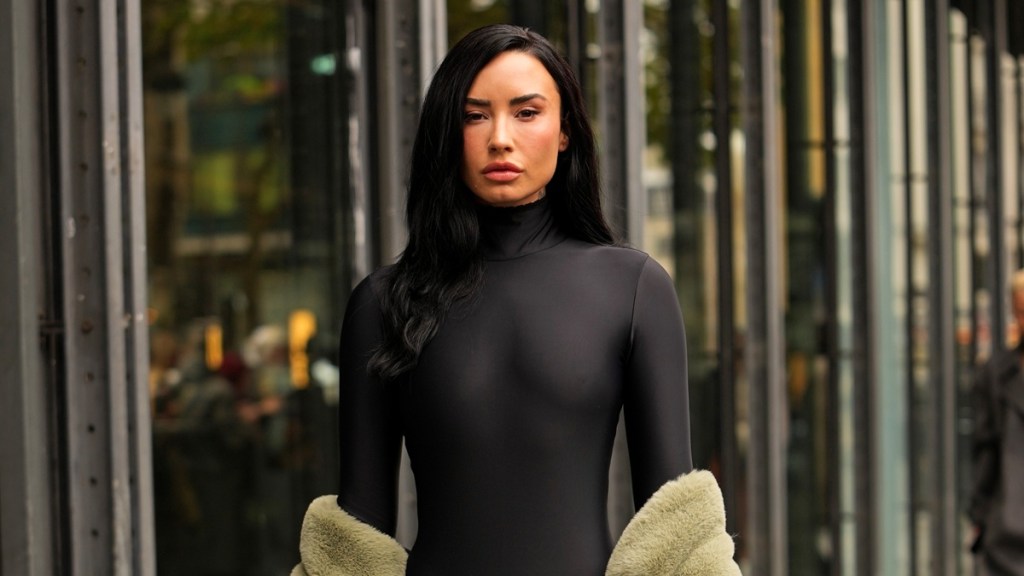 Demi Lovato Wearing Bodysuit With Sheer Tights Will Make You Look Twice