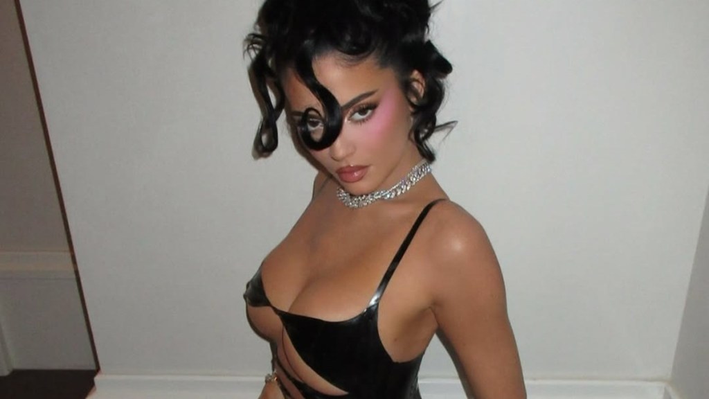Kylie Jenner Sitting in Latex Cut-Out Dress Will Make You Look Twice