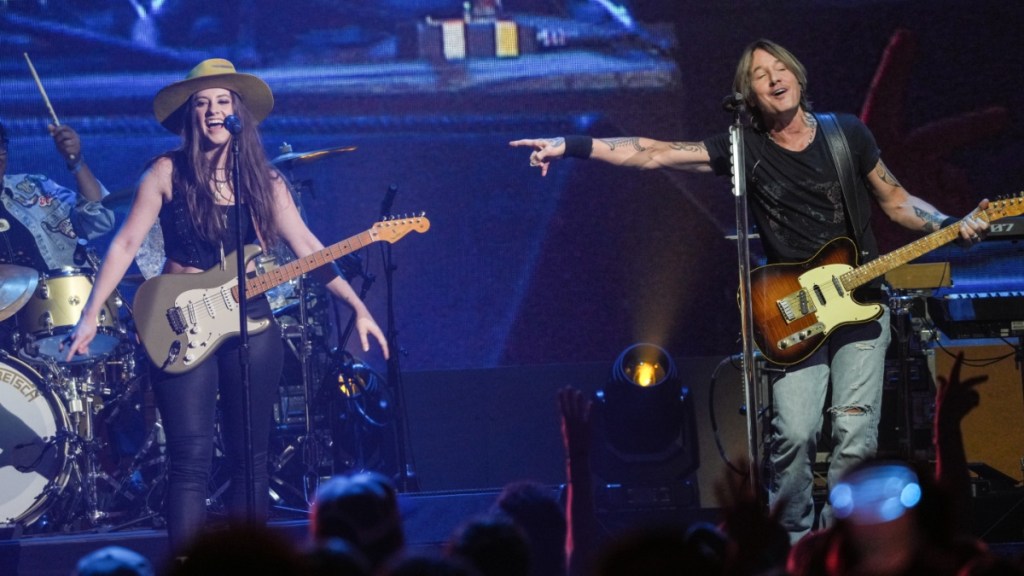 Keith Urban's Guitarist Sings About 'Fighting Feelings' Amid Romance Rumors