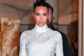 Photos: Kim Kardashian Is 'Standing on Business' in White Lace Dress