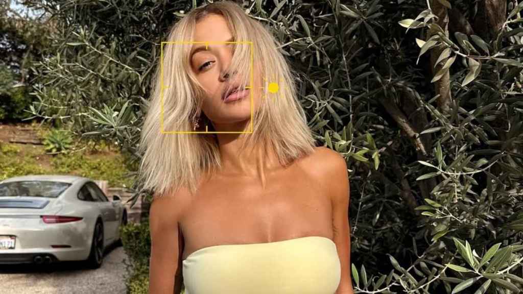 Rita Ora Showcases Her Toned Abs in Yellow Bandeau