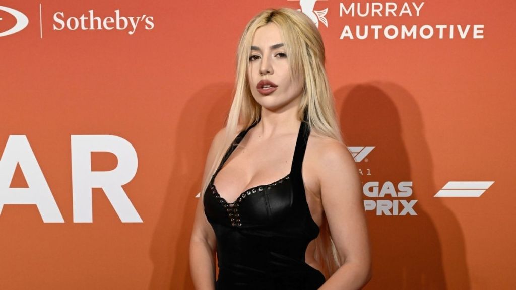 Ava Max Flaunts Cheeky Tie-up Detail in Sleek Black Dress Photo