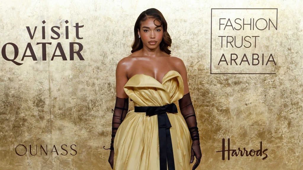 Lori Harvey in Thigh-High Slit Dress Has Fans Saying 'Damn Girl'