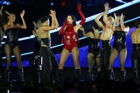 Dua Lipa’s Fiery Red Bodysuit Entirely Relies on Only Two Belts