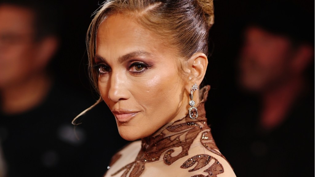 Jennifer Lopez's Sheer Gown Exposes Her Toned Abs