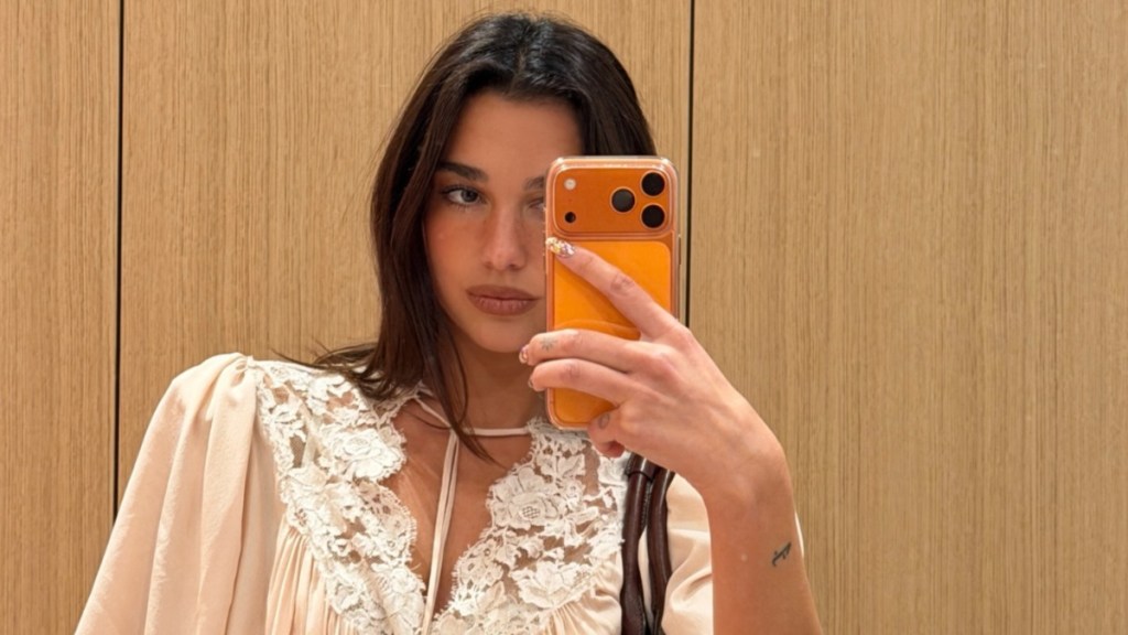 Dua Lipa's Low-Cut Top Exposes Lacey Bra