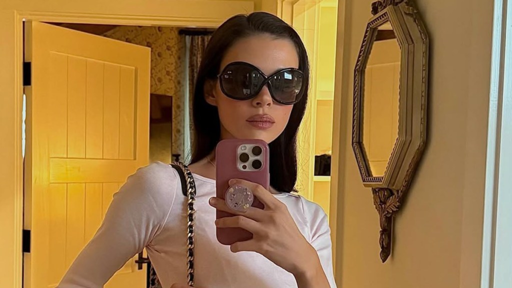 Nicola Peltz Beckham Rocks Striped Minidress With Chanel Bag