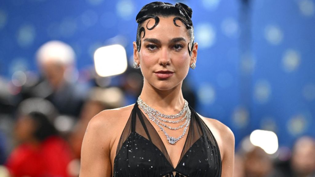 Dua Lipa Dons Only Bra Under Fully Sheer Shirt in YSL Beauty Ad