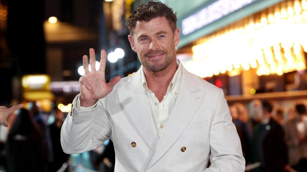 Chris Hemsworth Wows in All-White Suit For Movie Premiere