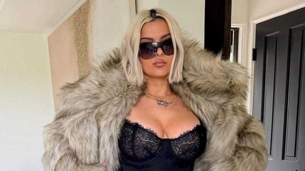 Bebe Rexha Makes a Statement in Lacy Top for NBA Game