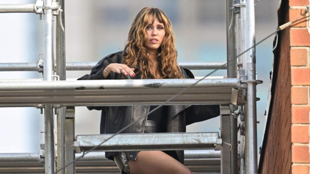 Miley Cyrus Turns Heads in Cami Top Hanging on by Strings for Maybelline