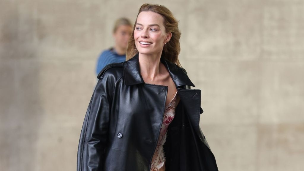 Margot Robbie Wears Burberry Trench Over Corset With Bold Neck