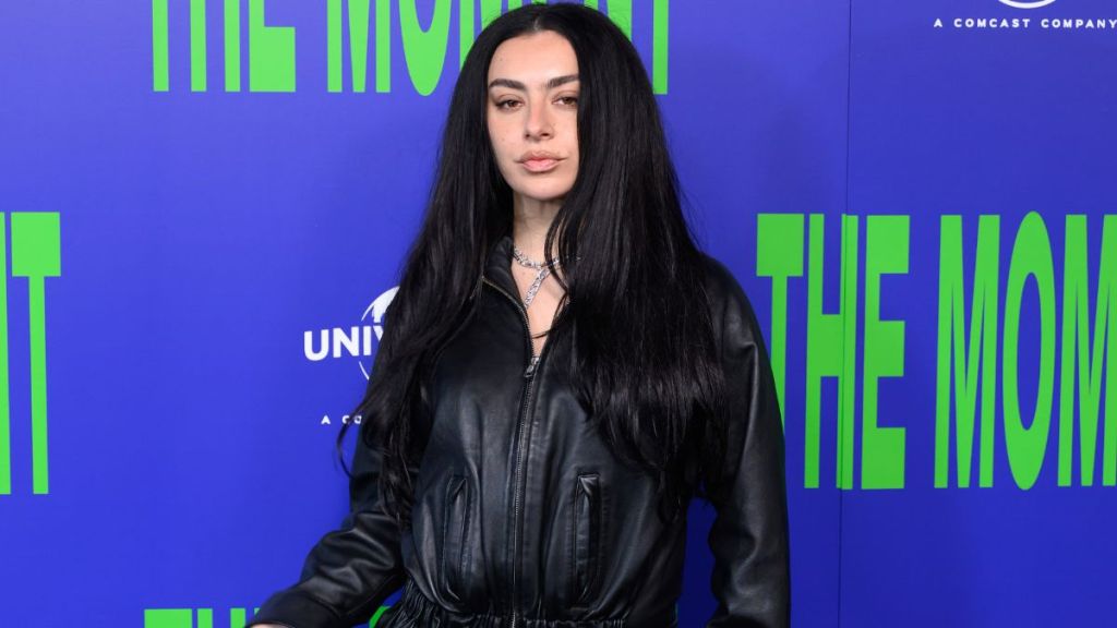 Charli XCX Sports Jacket as Micro Minidress With August Barron Boots