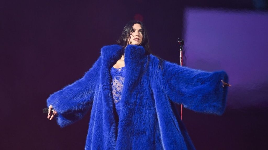 Dua Lipa Cozies up in Chic Fur Coat for Service95 Milestone