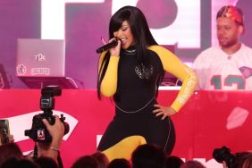 Cardi B Styles Bodysuit With Holes All Over & Sheer Tights Amid Tour
