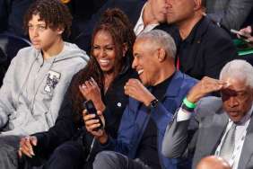 Barack Obama Seemingly Guards Wife From Flying Basketball at NBA Game