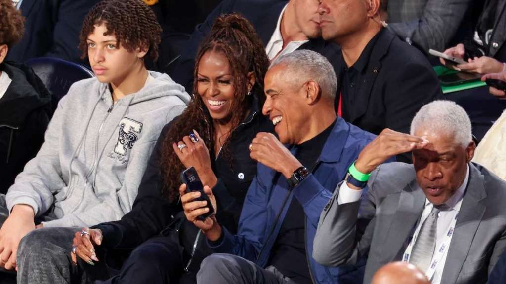 Barack Obama Seemingly Guards Wife From Flying Basketball at NBA Game
