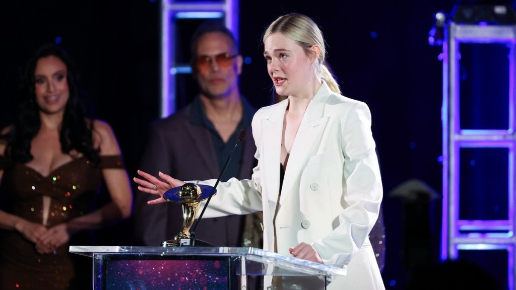 Elle Fanning Styles Strapless Bikini Top Under Blazer at Saturn Awards