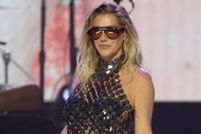 Kesha Turns Heads in Sheer Corset Top With Big Cut-Out for Women’s Day