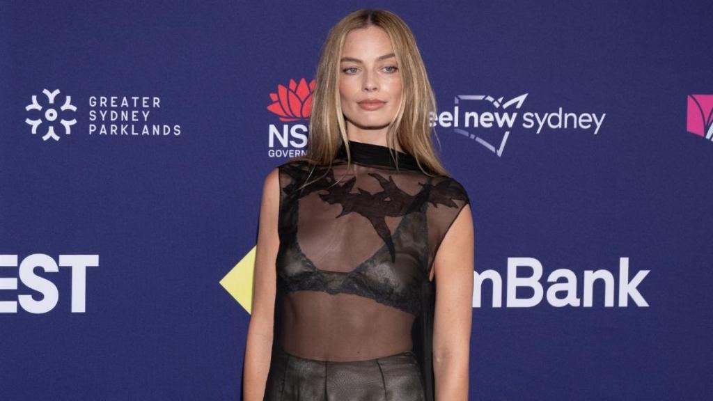 Margot Robbie Sports Jacket Held Together by Just a Button for Chanel