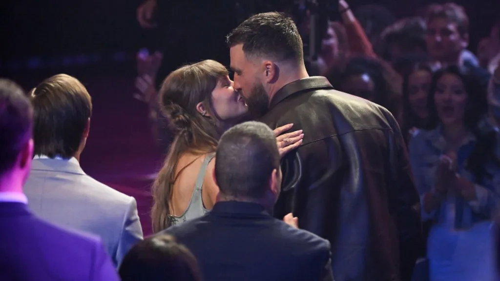 Travis Kelce Is Taylor Swift’s Literal Hype Man After iHeartRadio Awards Wins